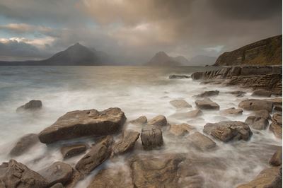 Stormy weather over Cuillin Mountains from Elgol beach, Skye, Scotland. 