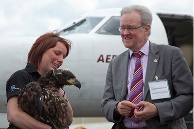 Claire Smith from RSPB speaks to MSP Stewart Stevenson on arrival of Norwegian chicks as part of the East Scotland Sea Eagle reintroduction project, Scotland. 